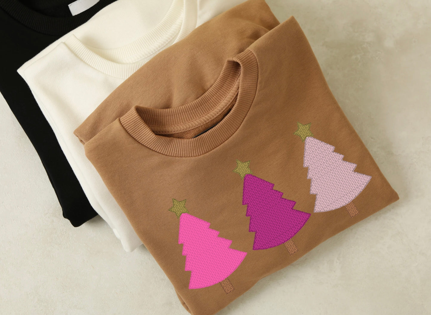 Tan sweatshirt with embroidered pink Christmas tree